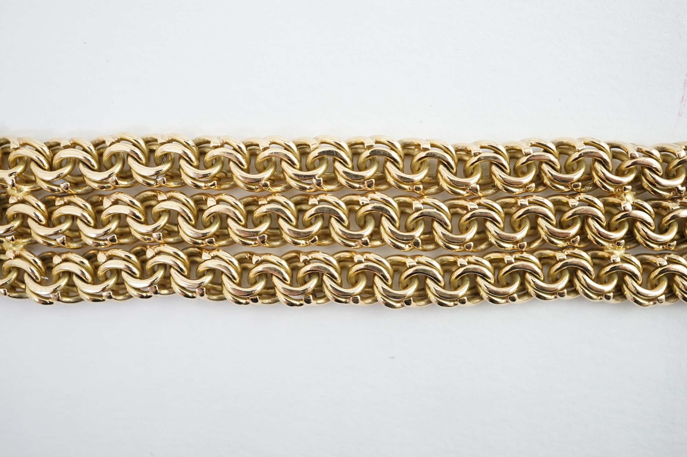 An 18k gold triple strand oval chain link bracelet